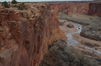 The Junction Overlook into the canyon walls and floor, 700 feet down.<br><i>From the National Park Service:<br>
'The name De Chelly is a Spanish corruption of the Navajo word 'Tsegi', which means roughly 'rock canyon'. The Spanish pronunciation 'day shay-yee' has gradually changed through English usage, and the name is now pronounced 'd'SHAY'.<br>
The streams of this region flow during the rainy seasons and during the spring runoff of mountain snows; at other times they are dry. Sandstones, chiefly the De Chelly Formation of Permian age, laid down more than 200 million years ago, compose the canyon walls. The reddish hue of the cliffs varies in intensity with the time of day.</i>