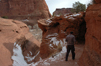 The trail tunnels through rocks at a couple of places. Here Matt strides towards one of the tunnels.