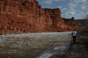 Matt walks along the slushy San Juan River