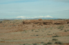 Snow capped mountains loom along the Utah highway
