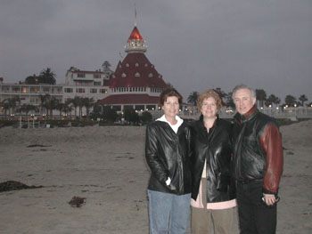 The Del Coronado rises in the distance as the vacationers gaze out to sea.