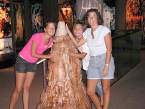 Kristin, Dani, and Kathy grab a feel of a model stalagmite